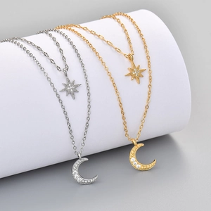 Elegant gold and silver double-layer star and moon necklace with sparkling crystals