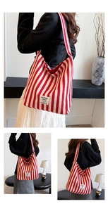 Close-up of red and white striped canvas tote bag with textured fabric and brand label