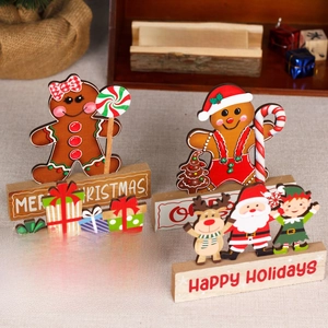 Wooden Christmas table decorations with gingerbread man and Santa Claus figures