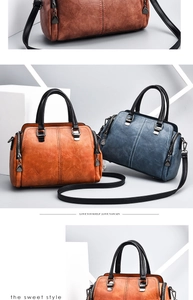 Detailed macro view of vintage faux leather textures on orange and blue boston bags