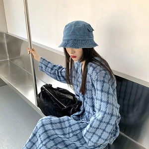 Blue denim bucket hat styled with a blue and white checkered dress on a model