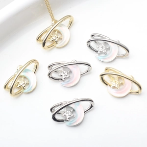 Flat lay of alloy crescent moon and star pendants with iridescent resin inlay