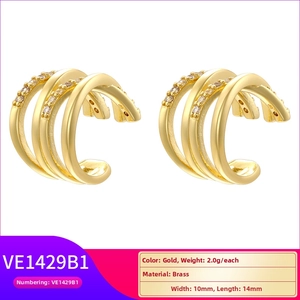 Detailed view of layered gold brass ear cuffs with faceted surface and cubic zirconia