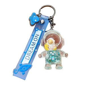 Astronaut liquid sand keychain with blue silicone wristband and transparent space figure