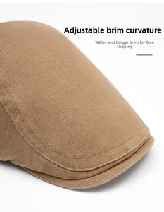 Detail of adjustable curved brim on brown beret hat showing durable cotton texture