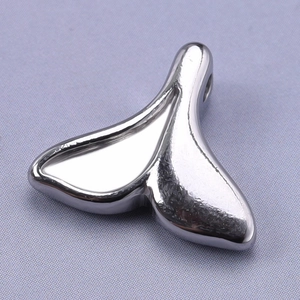 Macro shot of polished silver 304 stainless steel fishtail pendant for DIY jewelry design