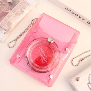 Detail of pink glitter PVC mini card holder with silver snap button and metal ball chain