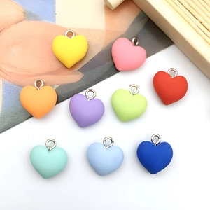 Colorful matte resin heart pendants in nine vibrant shades for DIY jewelry making