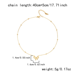 Detail view of 18K gold butterfly pendant necklace with dimensions and weight parameters
