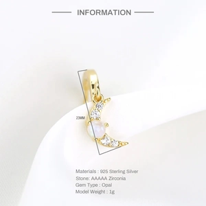 Detail of 925 sterling silver moon earring with white zirconia and opal on white fabric