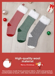 Detail of three knitted Christmas stockings with plush white faux fur cuffs and stripes