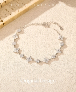 Detail of S925 sterling silver four-leaf clover bracelet with sparkling cubic zirconia