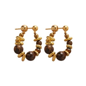 Golden stainless steel hoop earrings with polished tiger eye stone beads set on white background