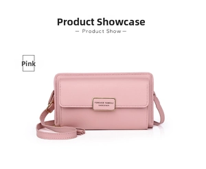 Close-up of pink PU leather phone bag with gold metal logo and adjustable shoulder strap