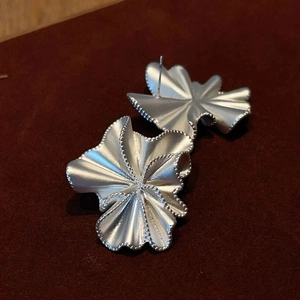 Minimalist silver pleated ruffle earrings with irregular wave design in matte finish