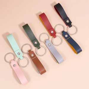 Minimalist faux leather keychains in eight colors with silver rings and pebble texture