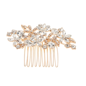 Detailed close-up of a bridal hair comb featuring intricate crystal floral patterns