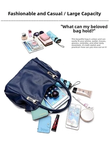 Navy blue large capacity women's shoulder bag showing daily essentials and tablet