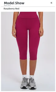 Close-up of raspberry red high-waisted yoga shorts featuring seamless knitted stretch fabric