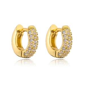 Close-up of gold-plated hoop earrings featuring multiple rows of sparkling zircon stones