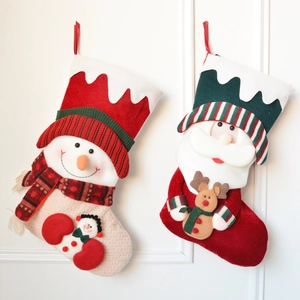 Thick knitted Christmas stockings featuring 3D plush Santa and Snowman decorations