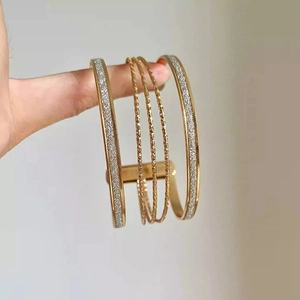 Minimalist multi-layer gold bangle set with frosted and twisted rope texture designs