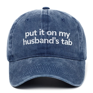 Navy washed denim baseball cap featuring white Put It On My Husband's Tab embroidery