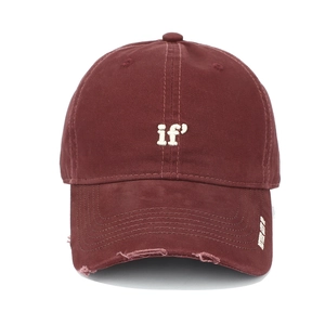 Detail of burgundy baseball cap with distressed brim and 'Never Give Up' embroidery