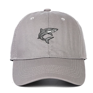 Close-up of a cartoon shark embroidery on a gray cotton twill baseball cap