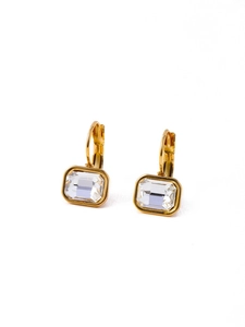Close-up of golden rectangle zircon earrings featuring a secure snap closure design