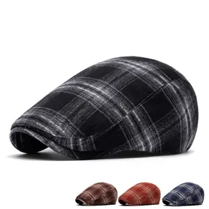 Vintage plaid newsboy cap for men and women featuring classic grey black checkered pattern