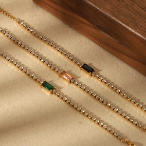 Three gold stainless steel bracelets with emerald, pink, and black rectangular zircons