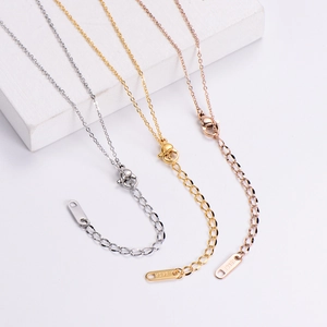 Detail of 18KGP engraved lobster clasp and adjustable extension chains in three colors