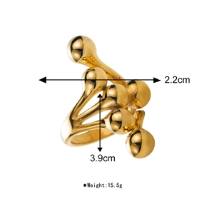 Detail view of the 3.9cm golden spherical cross ring with dimensions and 15.5g weight info