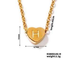Detailed view of gold heart pendant with letter H engraving showing size and weight specs