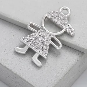 Macro detail of cubic zirconia girl charm in rhodium-plated brass for DIY jewelry