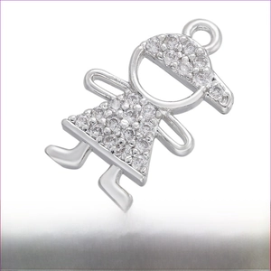 Macro detail of cubic zirconia girl charm in rhodium-plated brass for DIY jewelry