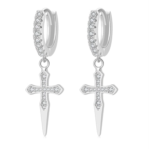 Detailed close-up of silver cross drop earrings with sparkling cubic zirconia inlay