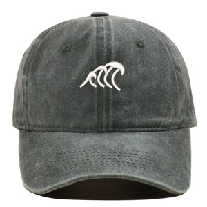 Close-up of white wave embroidery on a vintage washed dark grey cotton baseball cap