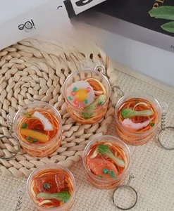 Detailed top view of miniature instant noodle keychains with realistic food ingredients