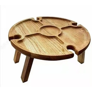 Portable wooden picnic snack table with built-in wine glass holders for outdoors
