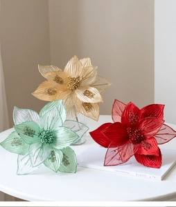 Detail of 25cm glitter mesh artificial Christmas flowers in gold, green, and red