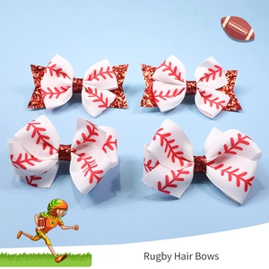 Detail of four rugby-themed hair bows with red glitter accents and stitched ribbon