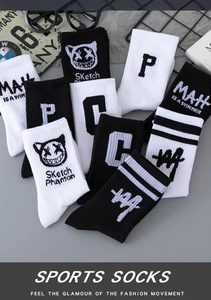 Detail of mid-calf cotton sports socks with letter print and street style graffiti graphics