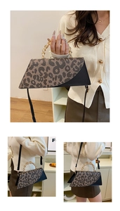 Detail of leopard print handbag with golden woven handle and black shoulder strap