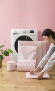 Detailed set of pink fine mesh laundry bags in various sizes for washing machine protection