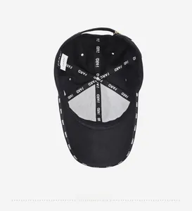 Detailed interior of black baseball cap showing branded seams and fabric texture