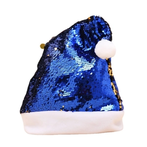 Blue sequin Christmas hat with reindeer antlers and white plush trim on white background