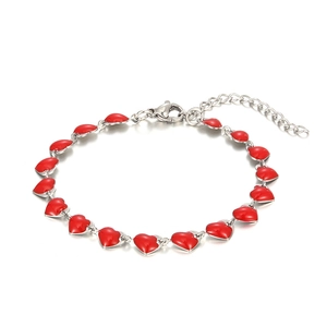 Detail of silver stainless steel chain bracelet featuring multiple red enamel hearts