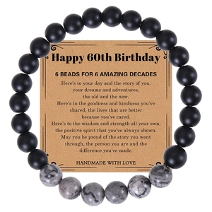 60th birthday gift set with matte black beads and map stone elastic bracelet on card